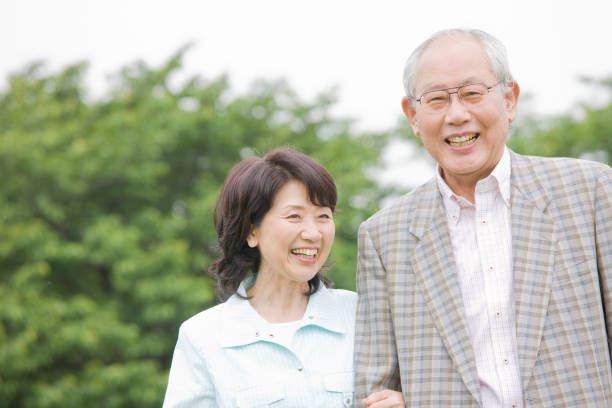istock An elderly couple to walk the Park arms 674227206