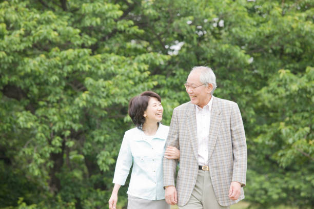 istock An elderly couple to walk the Park arms 674227230
