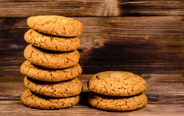 istock Stack of the oatmeal cookies on wooden table 674227264