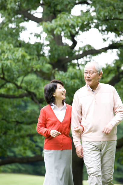 istock An elderly couple to walk in the Park 674228250