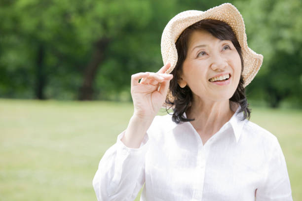 istock Woman wearing a hat, a walk in the Park 674228518