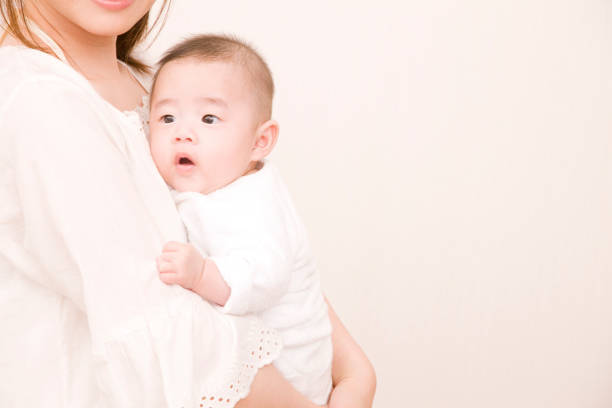 istock Mother holding baby 674233962
