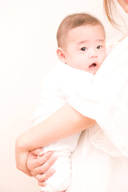 istock Mother holding baby 674233982