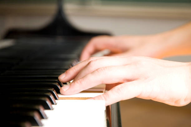 istock Men's junior high school students playing the piano 674236098