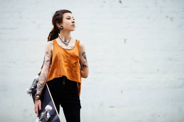 istock Alternative lifestyle with tattoos and piercings 674236520