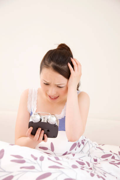 istock Sleep and women have held the head in bed 674237202