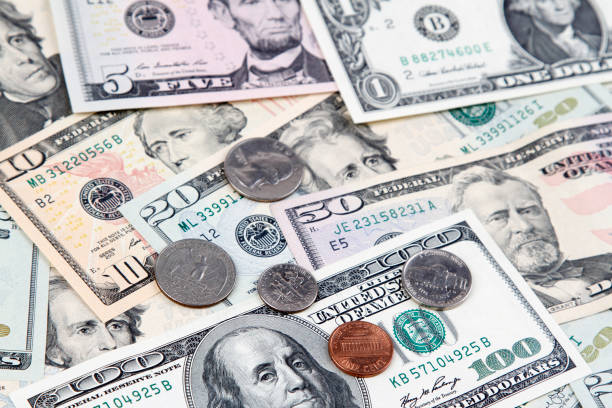 istock American coins and banknotes 674238008