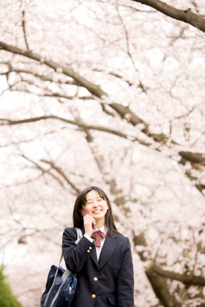 istock Women's junior high school students speak on the phone 674238016
