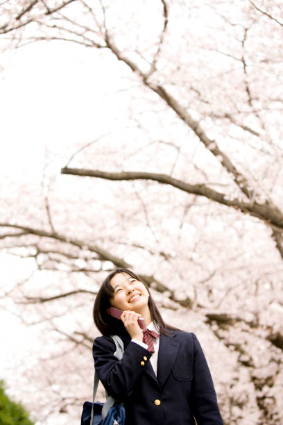 istock Women's junior high school students speak on the phone 674238030