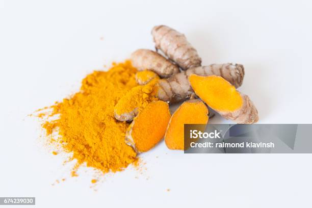 Turmeric Roots With Turmeric Powder Isolated On White Background Stock Photo - Download Image Now