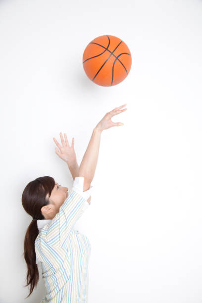 Woman to shoot a basketball