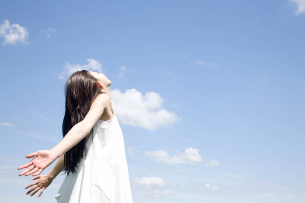 istock Women look up to the sky 674244272