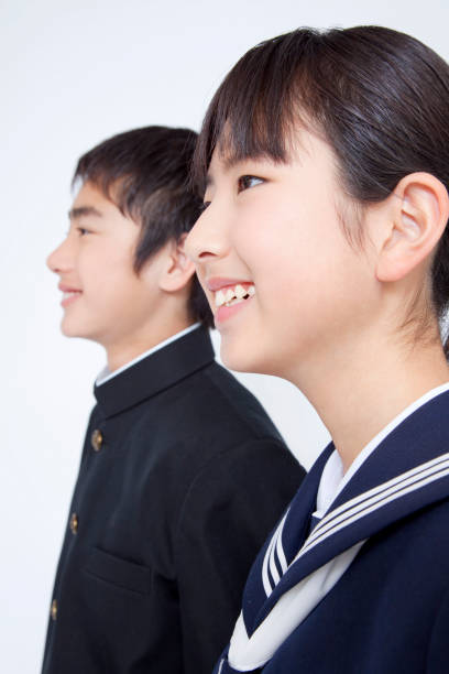 istock Male and female junior high school students smile 674251658