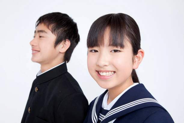 istock Male and female junior high school students smile 674251670