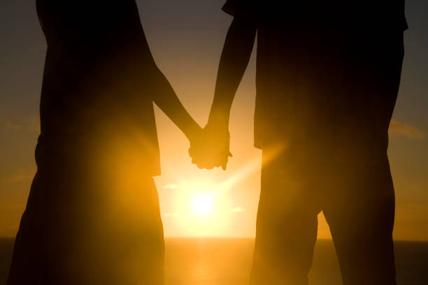 istock Couple tie hand at sunset silhouette 674258836