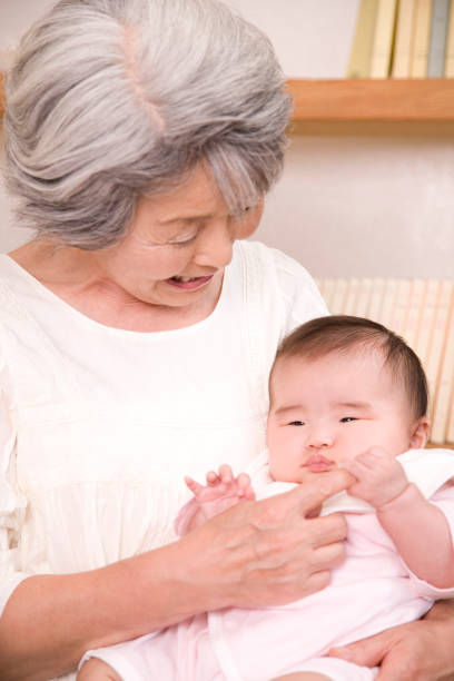 istock Nursing a granddaughter grandmother 674259436
