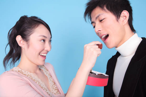 istock Women make men eat chocolate 674266382