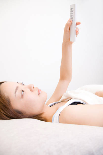 istock Turn off the room light woman 674266640