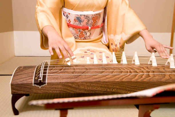 istock Woman playing the harp in hand 674267938