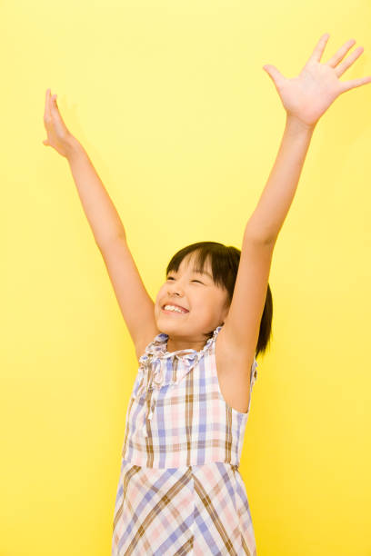 istock Girls raising hands 674271428