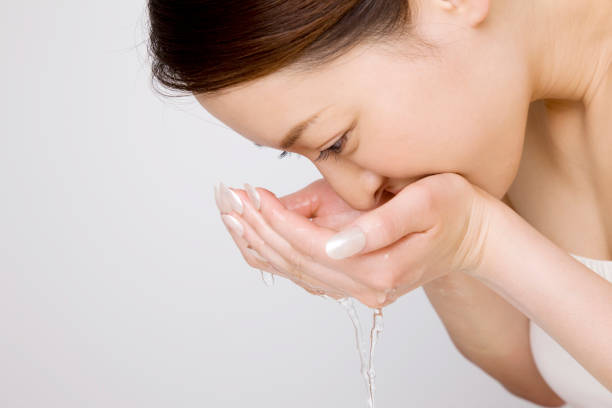 istock Woman washing face 674278636