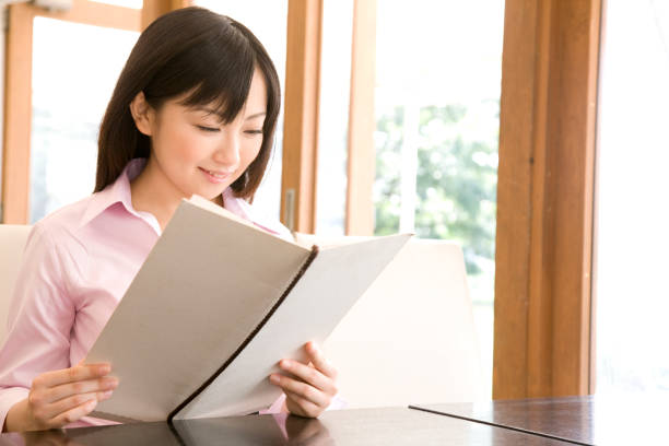 istock Women look at the menu Board 674279076