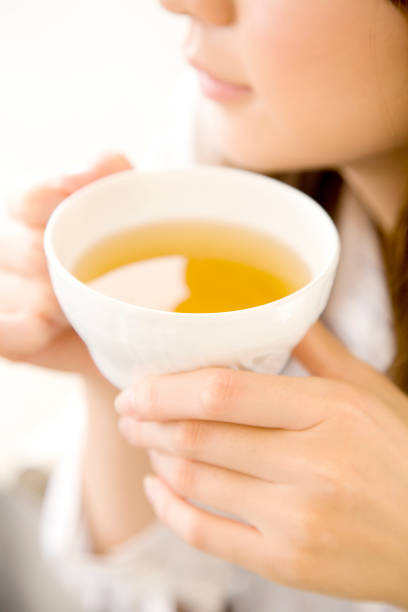 istock Mouth of a woman drinking tea 674279380
