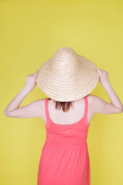 istock Woman wearing a straw hat 674279872