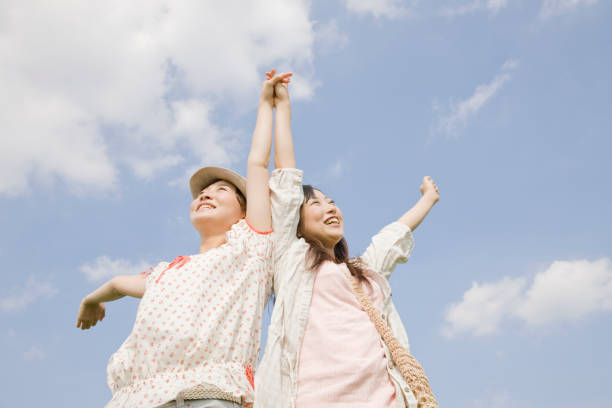 istock Two women holding hands, reach out your hands 674284696