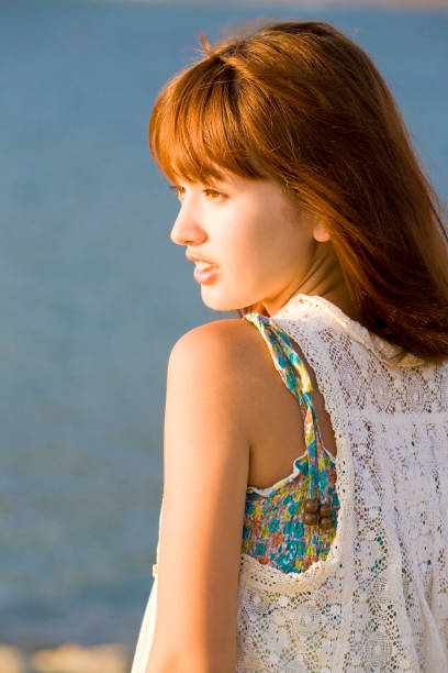 istock Woman overlooking the sea 674284706