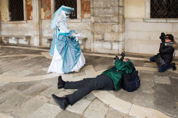 venice carnival - photographer taking pictures of venetian mask on st. mark's square in venice. - reportage photographer photographing street imagens e fotografias de stock