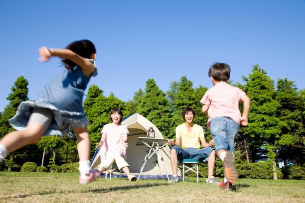 istock Two children over to parents 674286816