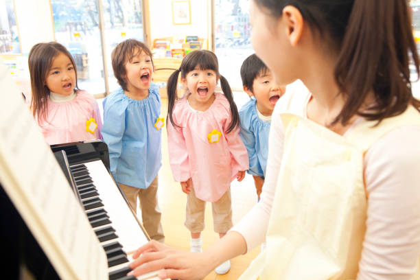 istock Piano teachers in kindergartens in the kindergarten sing along 674291562