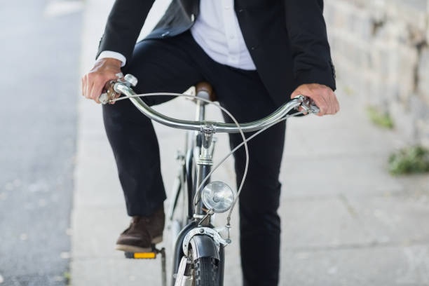 istock Midsection of businessman on bicycle 674296616