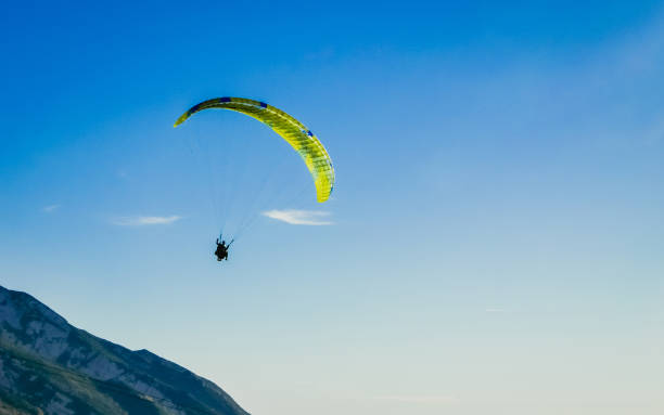istock Paragliding tandem flying over the mountains. Freedom concept 674297974