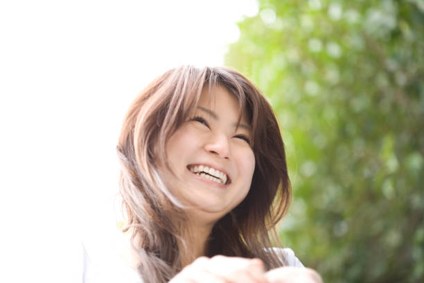 istock Women under the cherry blossoms 674298704