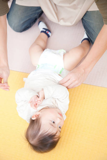 istock Nursery changing diapers and nursery garden boys 674302042