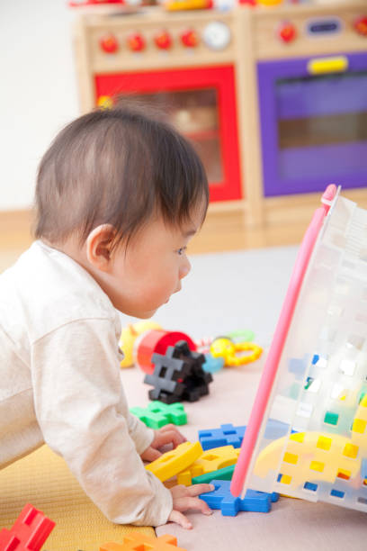 istock Nursery garden boys play with toys 674302174