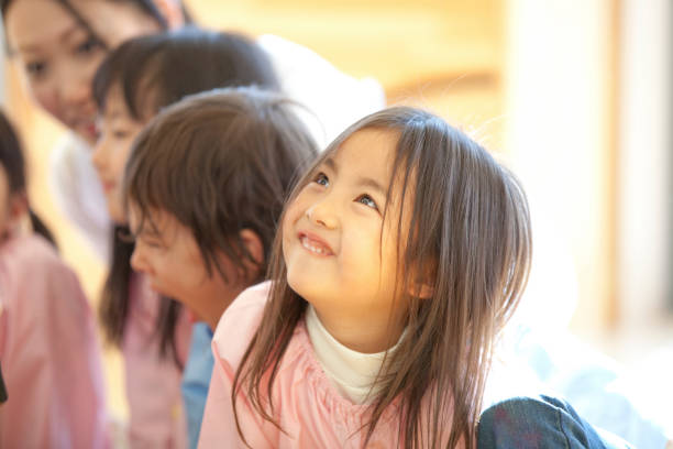 istock Kindergarten girls smile 674302568