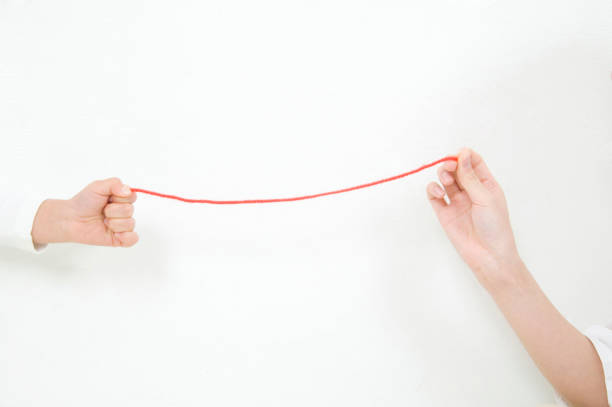 istock Red thread with mother and daughter 674308542