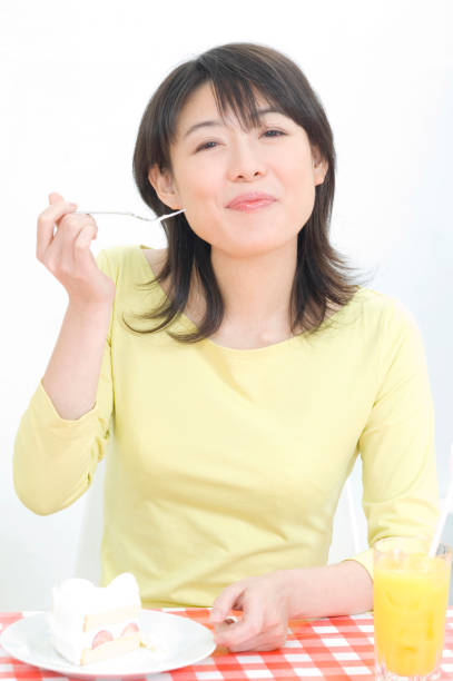 istock Woman eating cake 674309514
