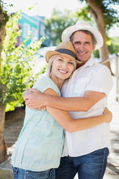 istock Couple embracing in park 674318096