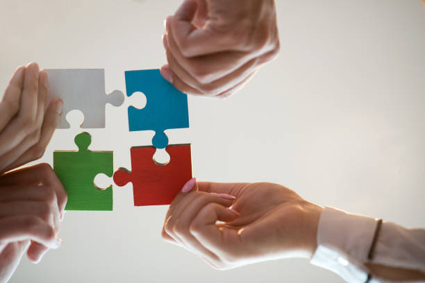 istock Business People Jigsaw Puzzle Collaboration Team Concept 674327668