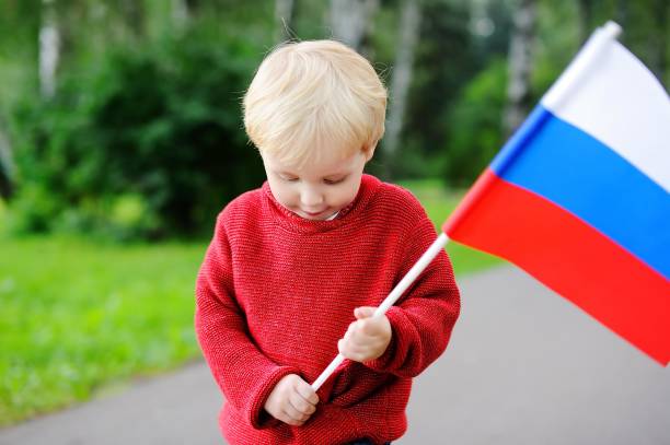 istock Toddler boy holding russian flag 674328588