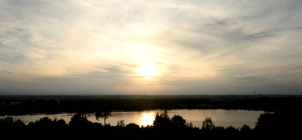 istock Silhouette of a forest against the sunset. 674334594