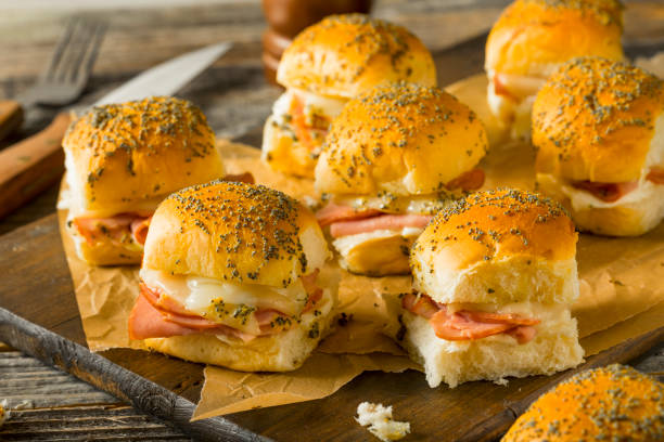 Hawaiian Ham and Cheese Buns Hawaiian Ham and Cheese Buns with Mayo and Poppy Seeds ham and cheese sandwich stock pictures, royalty-free photos & images