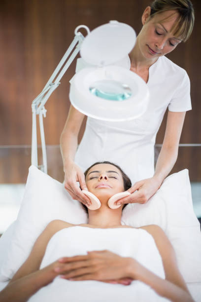 istock Masseur massaging woman 674341310