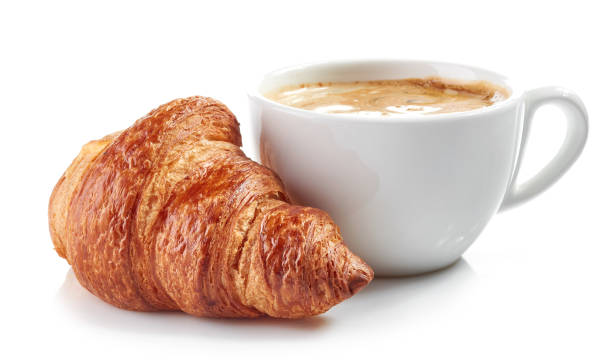 istock cup of coffee and croissant 674344468