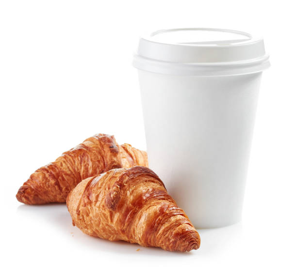 istock paper cup of coffee and croissants 674344470