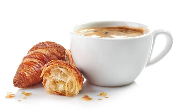 istock cup of coffee and croissants 674344476